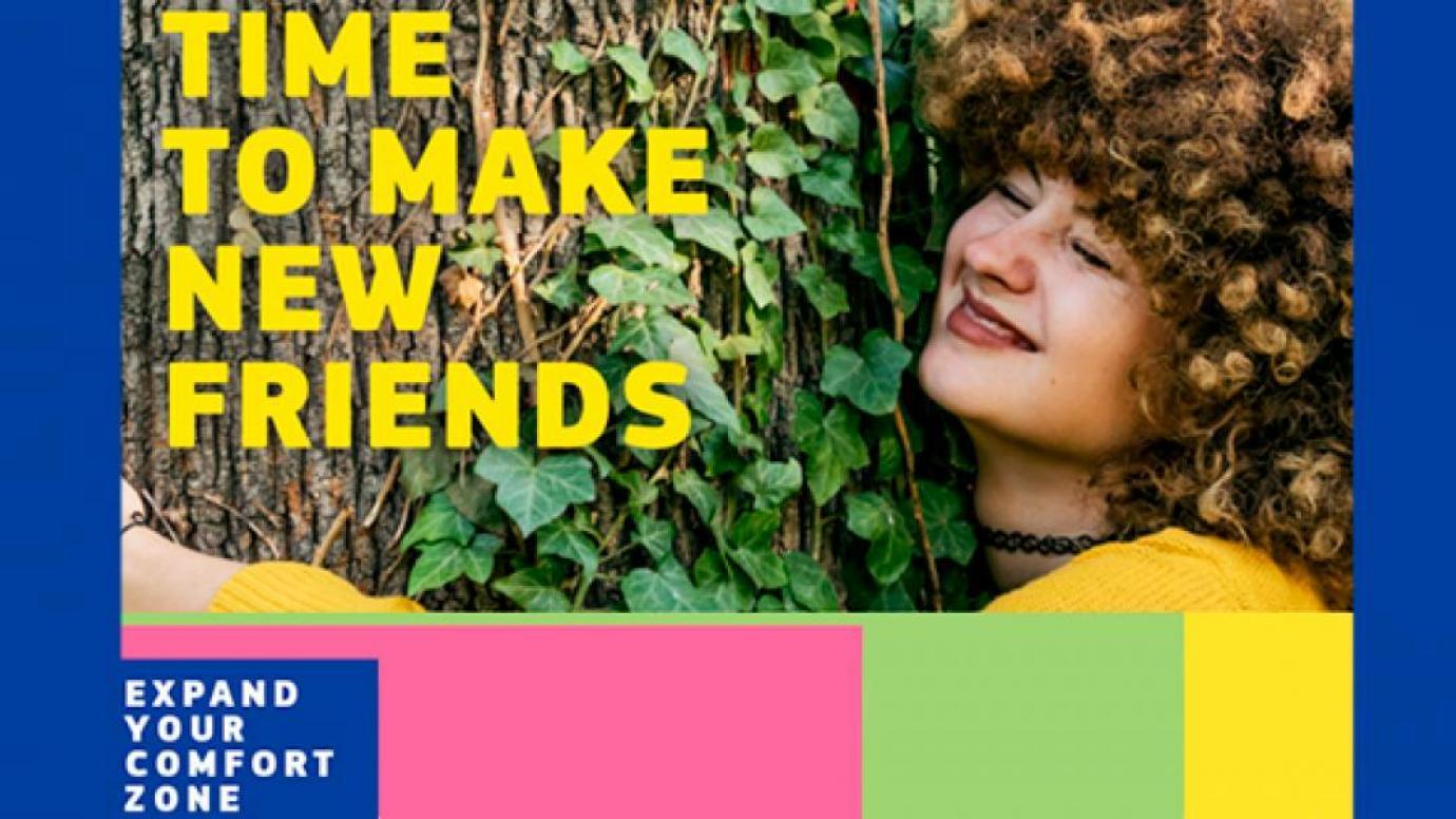 A girl hugging a tree and the words "Time to make new friends"
