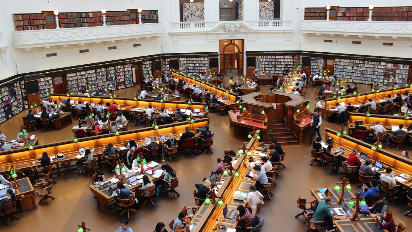 Arial view of students studying in a university library