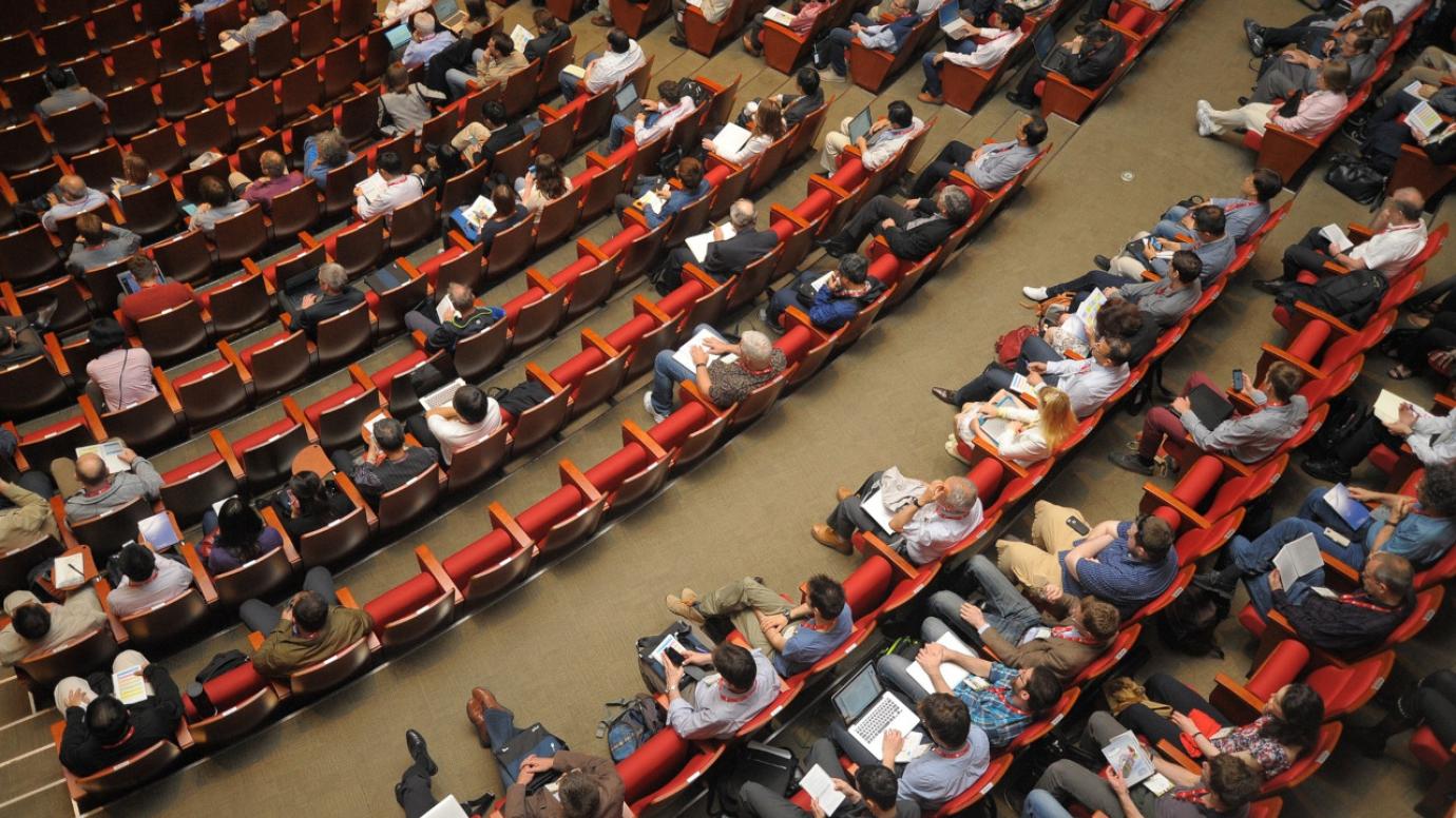 Attendees in a conference